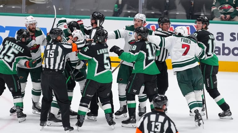 Players scuffle at the end of Game 1 of a...