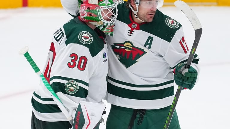Minnesota Wild goaltender Jesper Wallstedt (30) reacts with left wing...