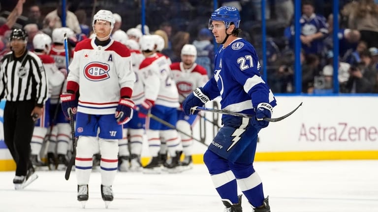 Tampa Bay Lightning defenseman Ryan McDonagh (27) skates off after...