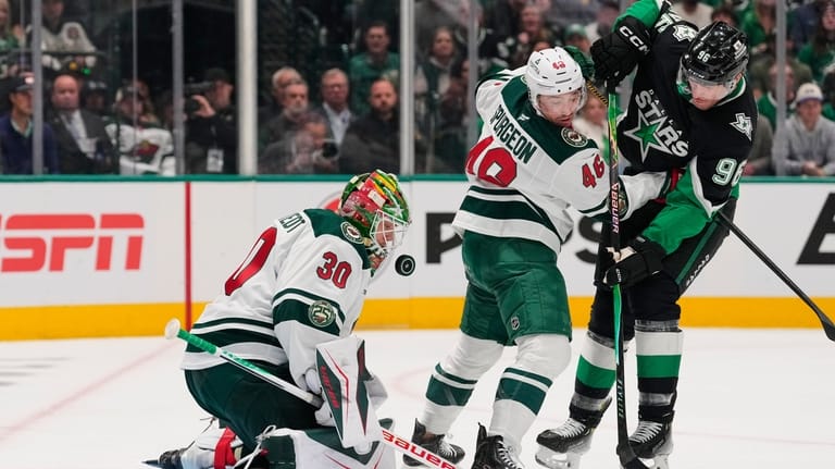 Minnesota Wild goaltender Jesper Wallstedt (30) defends against a shot...