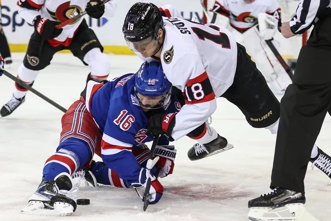 Mar 23, 2026; New York, New York, USA; New York Rangers center Vincent Trocheck (16) and Ottawa Senators center Tim Stützle (18) battle for control of the puck during a faceoff in the first period at Madison Square Garden.
