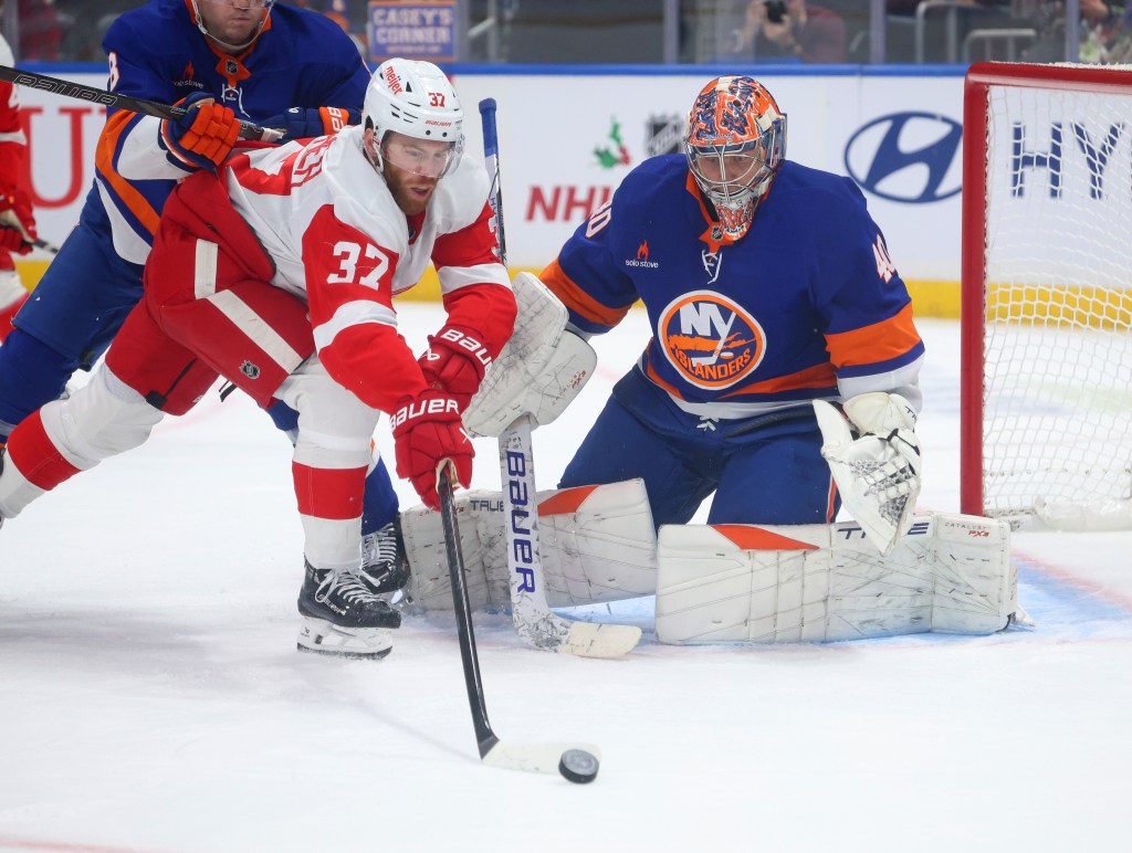 New York Islanders goaltender Semyon Varlamov (40) makes a stop on a shot by Detroit Red Wings left wing J.T. Compher (37) during the second period when the New York Islanders played the Detroit Red Wings Monday, November 25, 2024 at UBS Arena in Elmont, NY. 