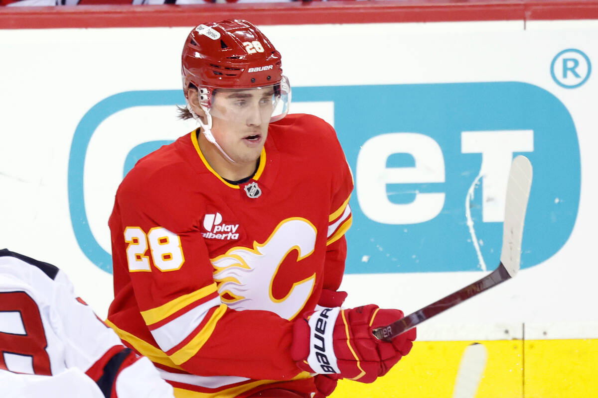 Calgary Flames defenseman Zach Whitecloud plays against the New Jersey Devils in an NHL hockey ...