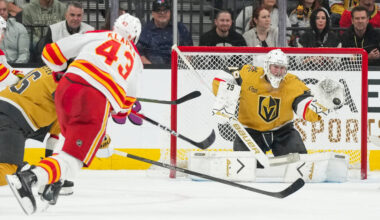 Vegas Golden Knights goaltender Carter Hart (79) stops a shot from Calgary Flames right wing Ad ...