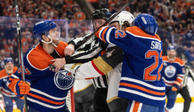 Vegas Golden Knights' Rasmus Andersson (4) roughs it up with Edmonton Oilers' Connor ...