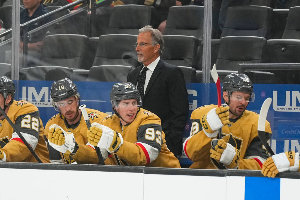 Vegas Golden Knights head coach John Tortorella, center top, looks on during the first period o ...