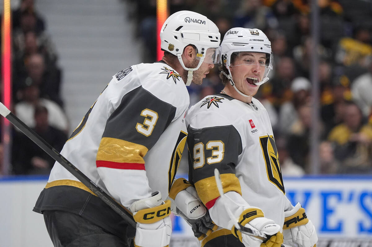 Vegas Golden Knights' Brayden McNabb (3) talks to Mitch Marner (93) before a faceoff durin ...