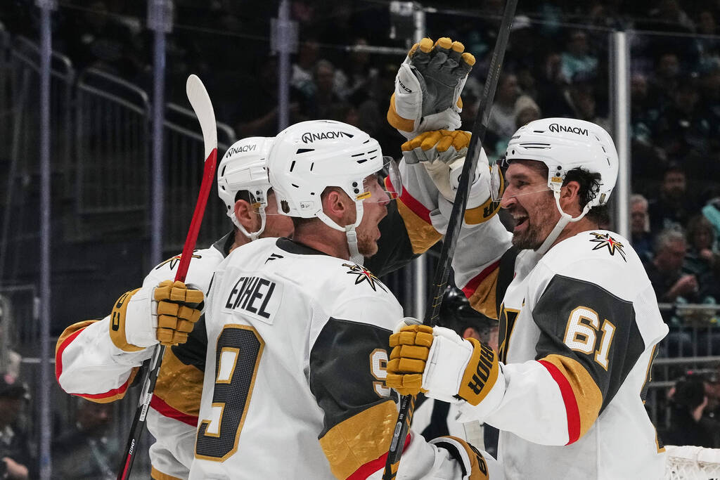Vegas Golden Knights right wing Mark Stone (61) celebrates his goal with center Jack Eichel (9) ...