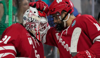 Wisconsin goaltender Daniel Hauser (31) and Wisconsin forward Simon Tassy (11) celebrate after ...