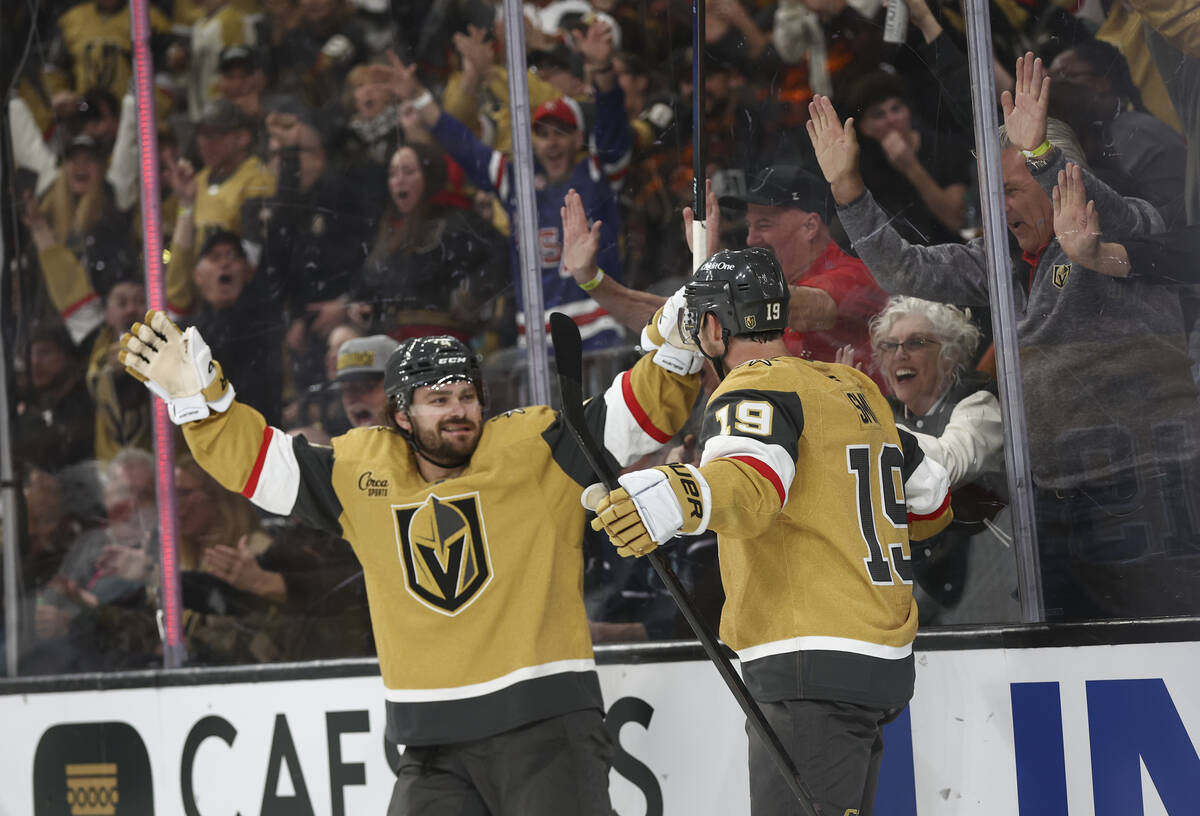 Golden Knights right wing Reilly Smith (19) celebrates his goal with defenseman Rasmus Andersso ...