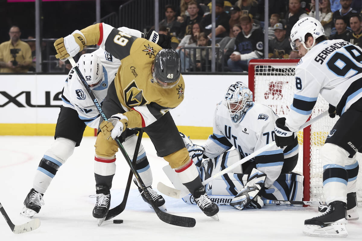Golden Knights left wing Ivan Barbashev (49) tries to get control of the puck against Utah Mamm ...