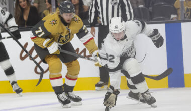 Los Angeles Kings defenseman Brandt Clarke (92) reaches out to tap the puck after losing his st ...