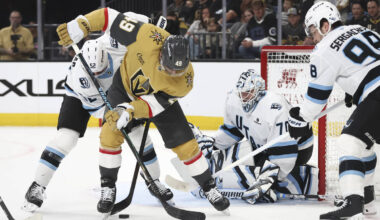 Golden Knights left wing Ivan Barbashev (49) tries to get control of the puck against Utah Mamm ...