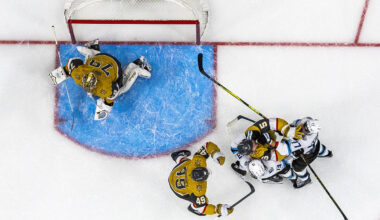Golden Knights defenseman Jeremy Lauzon (5) fights with Utah Mammoth left wing Brandon Tanev (1 ...