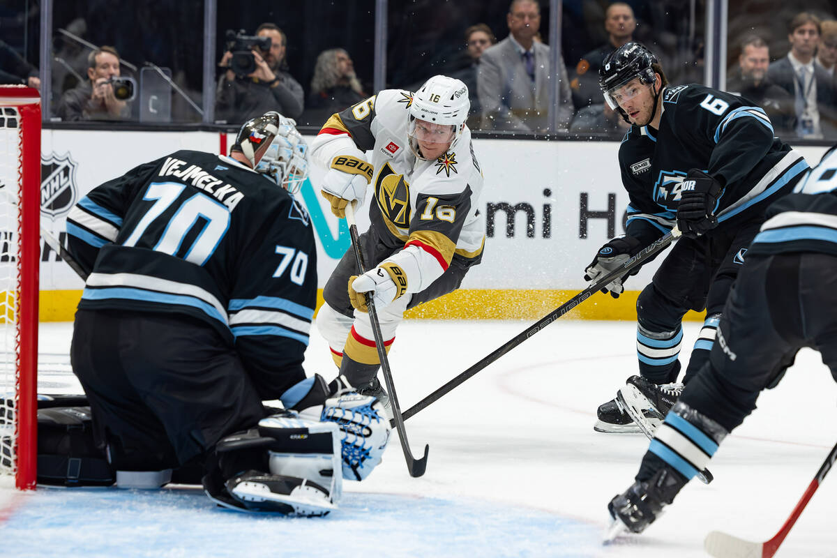Vegas Golden Knights right wing Pavel Dorofeyev (16) passes the puck against Utah Mammoth goalt ...