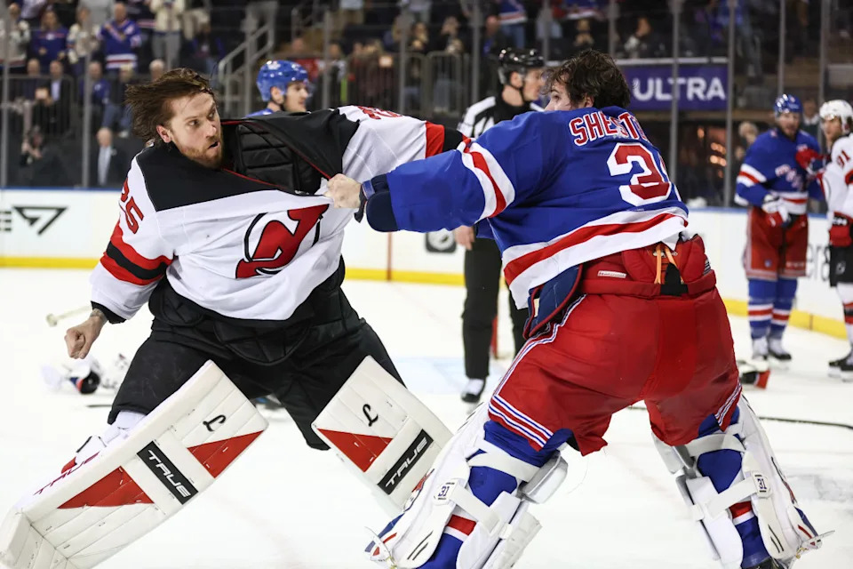 New York Rangers goaltender Igor Shesterkin (31) and New Jersey Devils goaltender Jacob Markstrom (25) fight at Madison Square Garden.Wendell Cruz-Imagn Images