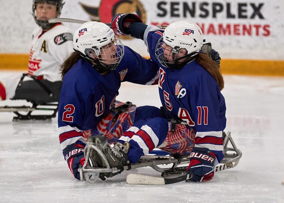USA’s Katie Ladlie (2) and Kelsey DiClaudio (11) celebrate one of USA’s seven goals - Photo @ Ellen Bond
