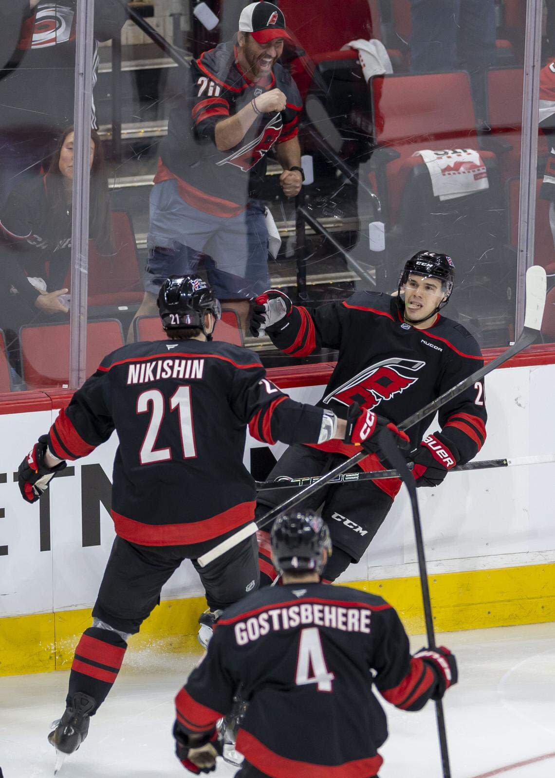 Carolina Hurricanes center Logan Stankoven (22) celebrates with Alexander Nikishin (21) after scoring to take a 1-0 lead over the Ottawa Senators in the second period on Saturday, April 18, 2026 during the first round of the Stanley Cup Playoffs at Lenovo Center in Raleigh, N.C.