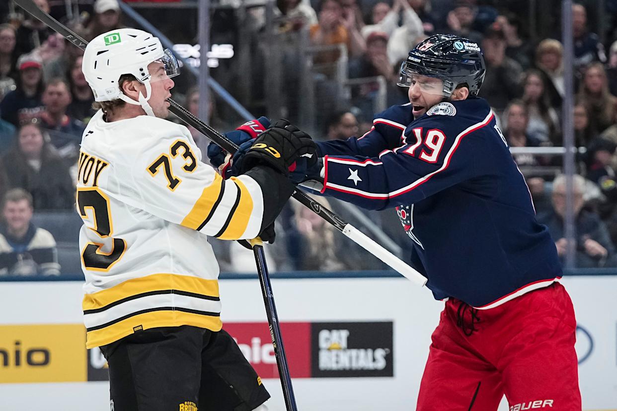 Columbus Blue Jackets center Adam Fantilli (19) shoves Boston Bruins defenseman Charlie McAvoy (73) during the first period of the NHL hockey game at Nationwide Arena on March 29, 2026.