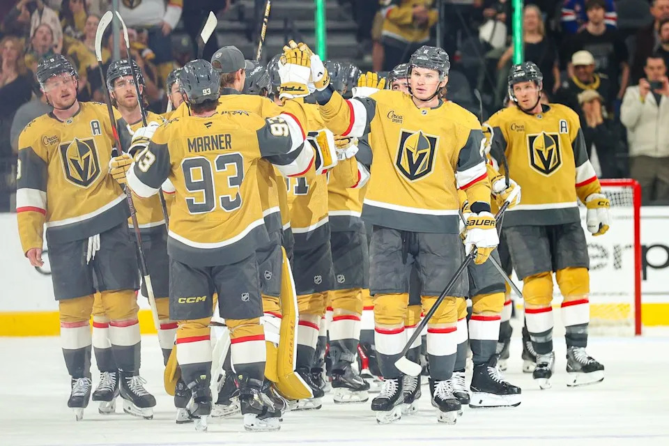 Vegas Golden Knights D Kaedan Korczak (6) high fives his teammates after defeating the Vancouver Canucks on Monday, March 30, 2026, in Las Vegas, Nevada.