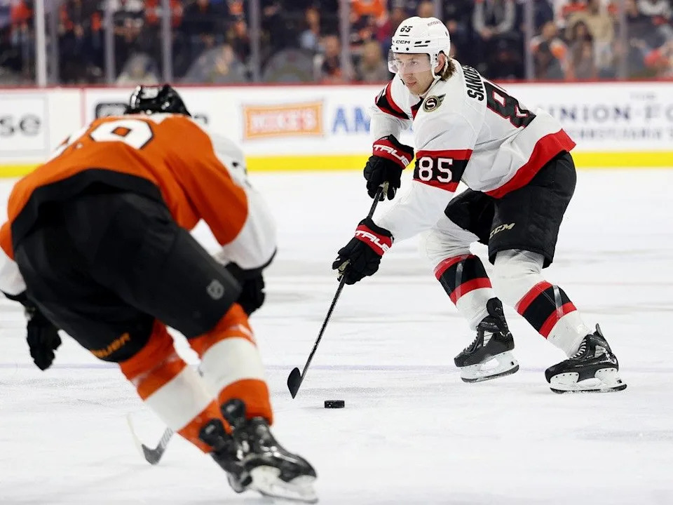  Jake Sanderson of the Ottawa Senators controls the puck during a game against Philadelphia in March 2025. Sanderson has 44 points in 54 games this season.