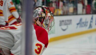 Calgary Flames netminder Dustin Wolf dials in during warmups ahead of the matchup against the Seattle Kraken. (Tony Trozzo/Victoria News)