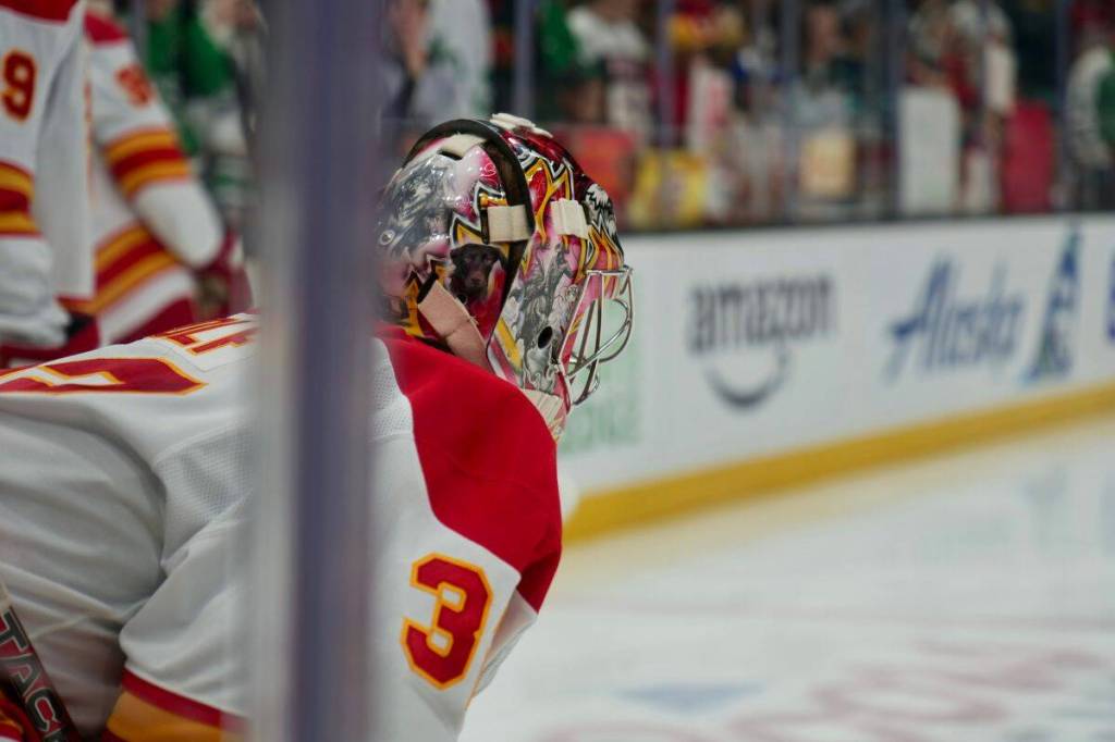 Calgary Flames netminder Dustin Wolf dials in during warmups ahead of the matchup against the Seattle Kraken. (Tony Trozzo/Victoria News)