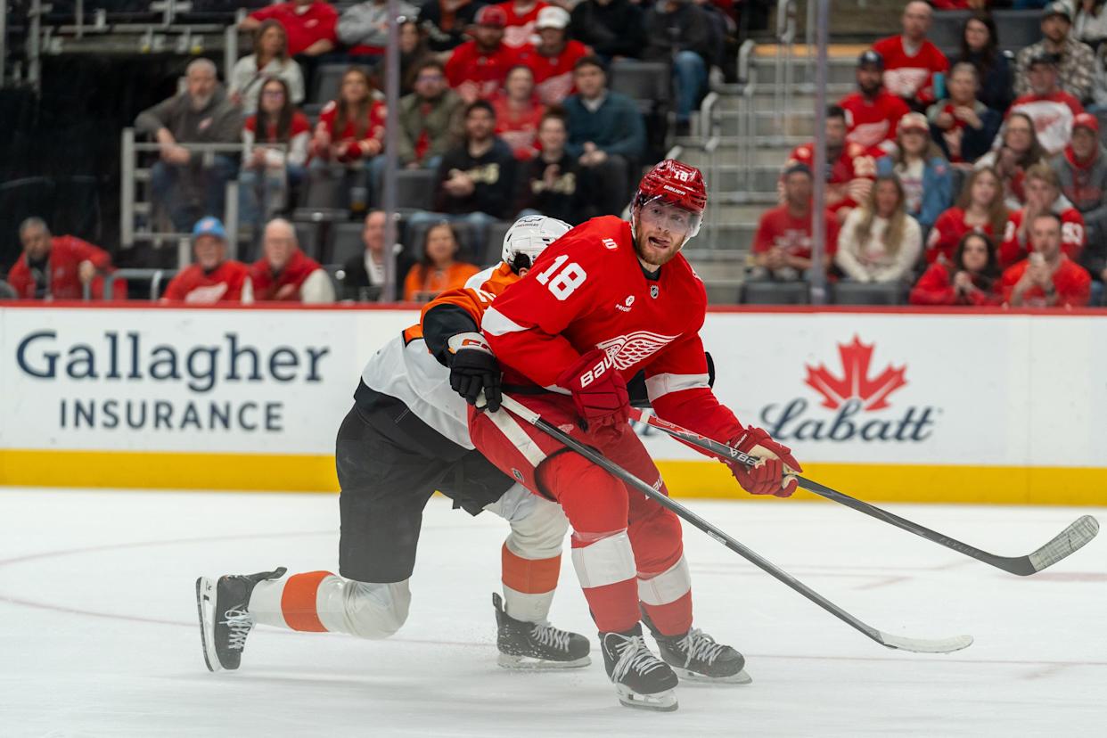 Andrew Copp (18) of the Detroit Red Wings skates with his tongue out during the first period of the game against the Philadelphia Flyers at Little Caesars Arena in Detroit on Thursday, April 9, 2026.