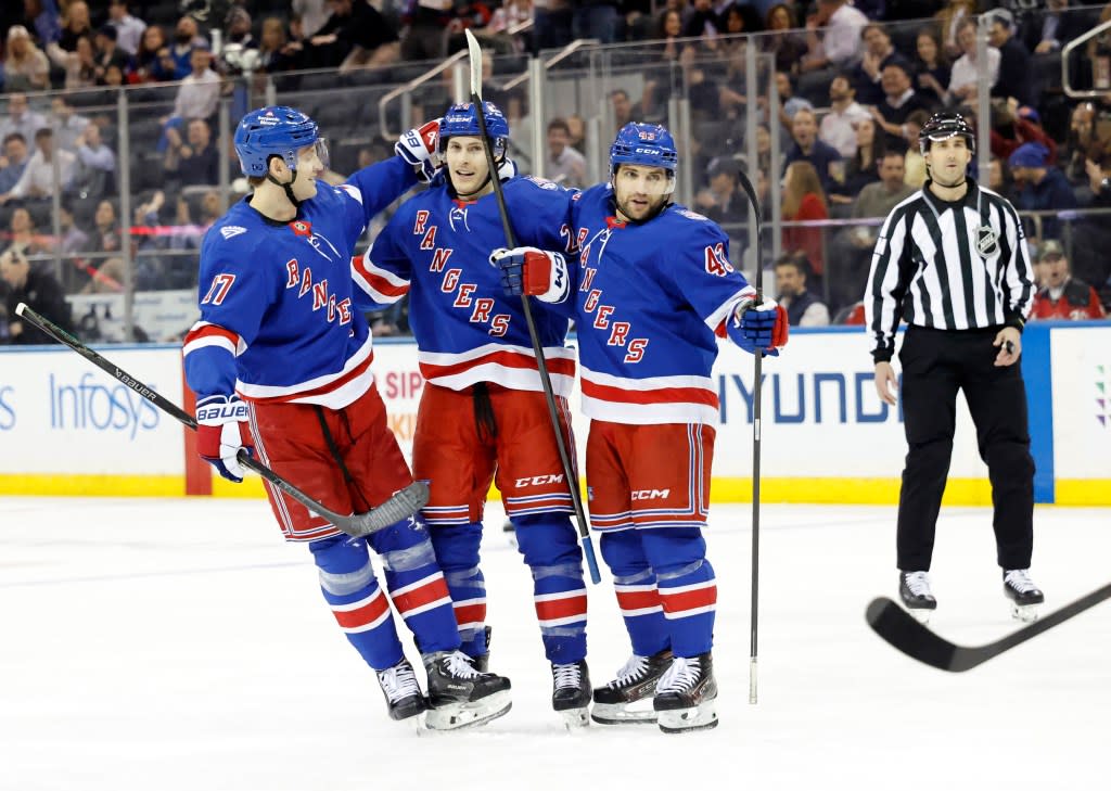 Tye Kartye (24) and Will Borgen (17) celebrate with left wing Conor Sheary (43) after Sheary scores a goal during the first period of the Rangers’ win over the Devils at the Garden. Jason Szenes for the New York Post
