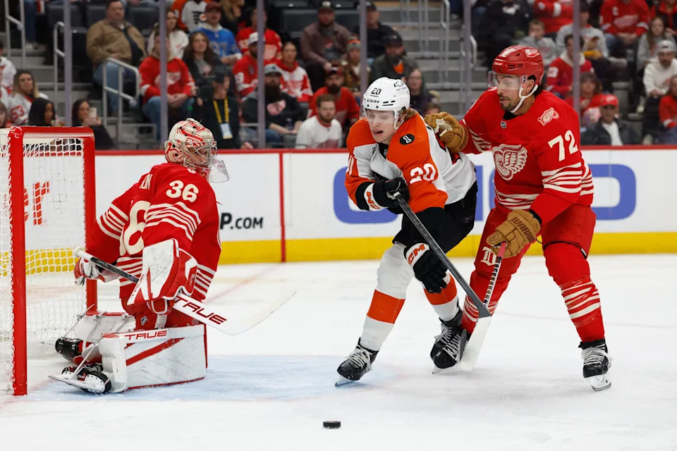 Philadelphia Flyers left wing Alex Bump (20) skates with the puck defended by Detroit Red Wings defenseman Justin Faulk (72) in the first period.