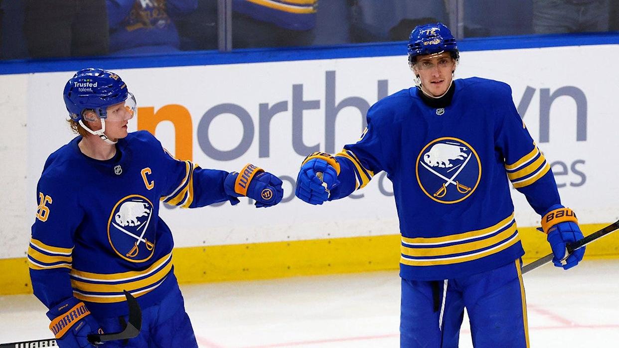 Buffalo Sabres center Tage Thompson celebrates goal with defenseman Rasmus Dahlin on ice