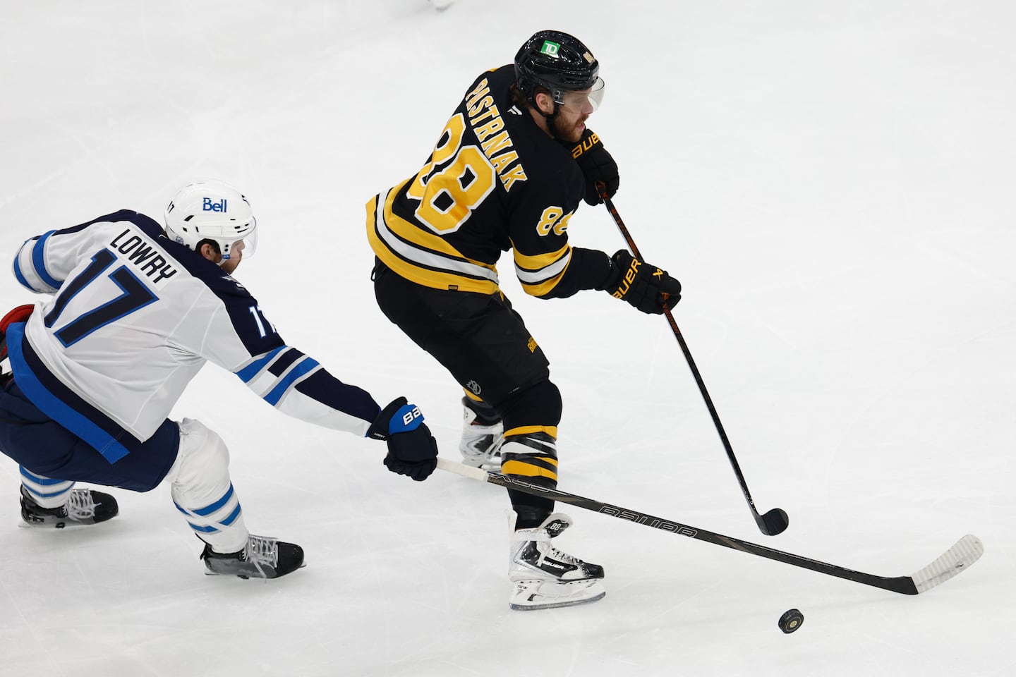 David Pastrnak (right) and the Bruins open the playoffs on the road.
