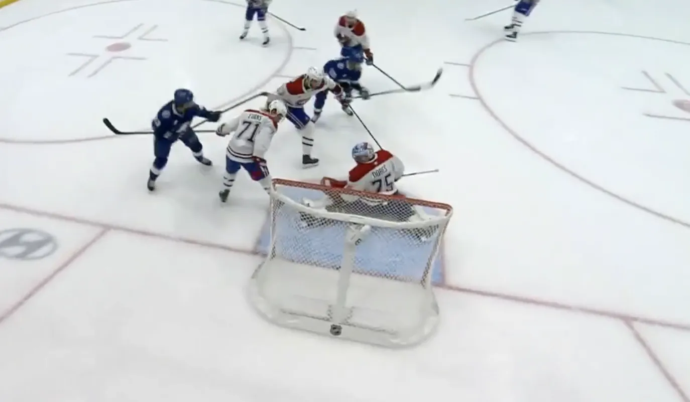 Photo of Tampa Bay Lightning scoring a goal against the Montreal Canadiens.