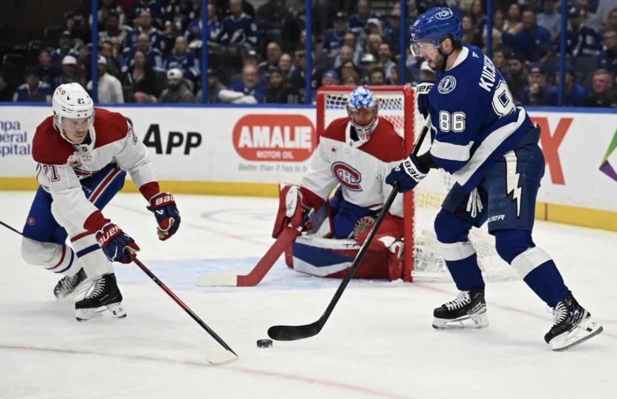 Tampa Bay Lightning right wing Nikita Kucherov (86) attempts to get past Montreal Canadian defensemen Kaiden Guhle (21) in the first period at Benchmark International Arena.