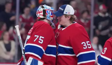 Montreal Canadiens goalie Jakub Dobes (75) celebrates the win against the Washington Capitals with teammate goalie Sam Montembeault (35) at the Bell Centre.