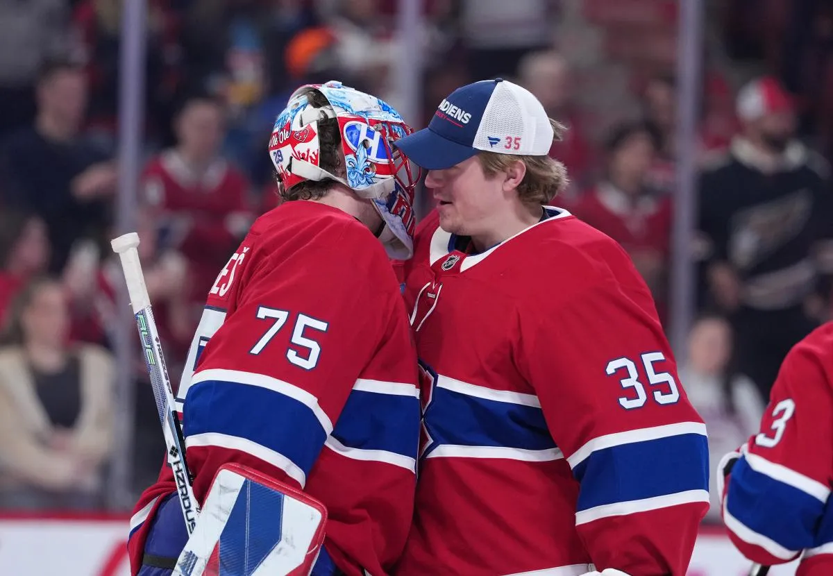 Montreal Canadiens goalie Jakub Dobes (75) celebrates the win against the Washington Capitals with teammate goalie Sam Montembeault (35) at the Bell Centre.