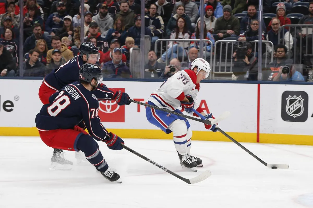 Montreal Canadiens center Zack Bolduc (76) prepares to shoot while Columbus Blue Jackets defenseman Damon Severson (78) tracks the play during the first period at Nationwide Arena.