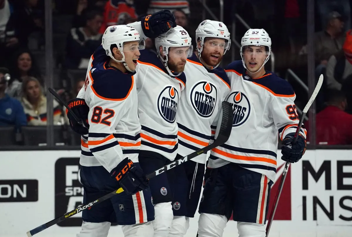 Edmonton Oilers defenseman Caleb Jones (82), center Ryan Nugent-Hopkins (93), defenseman Adam Larsson (6) and center Ryan Nugent-Hopkins (93) celebrate after a goal against the Los Angeles Kings in the first period at Staples Center