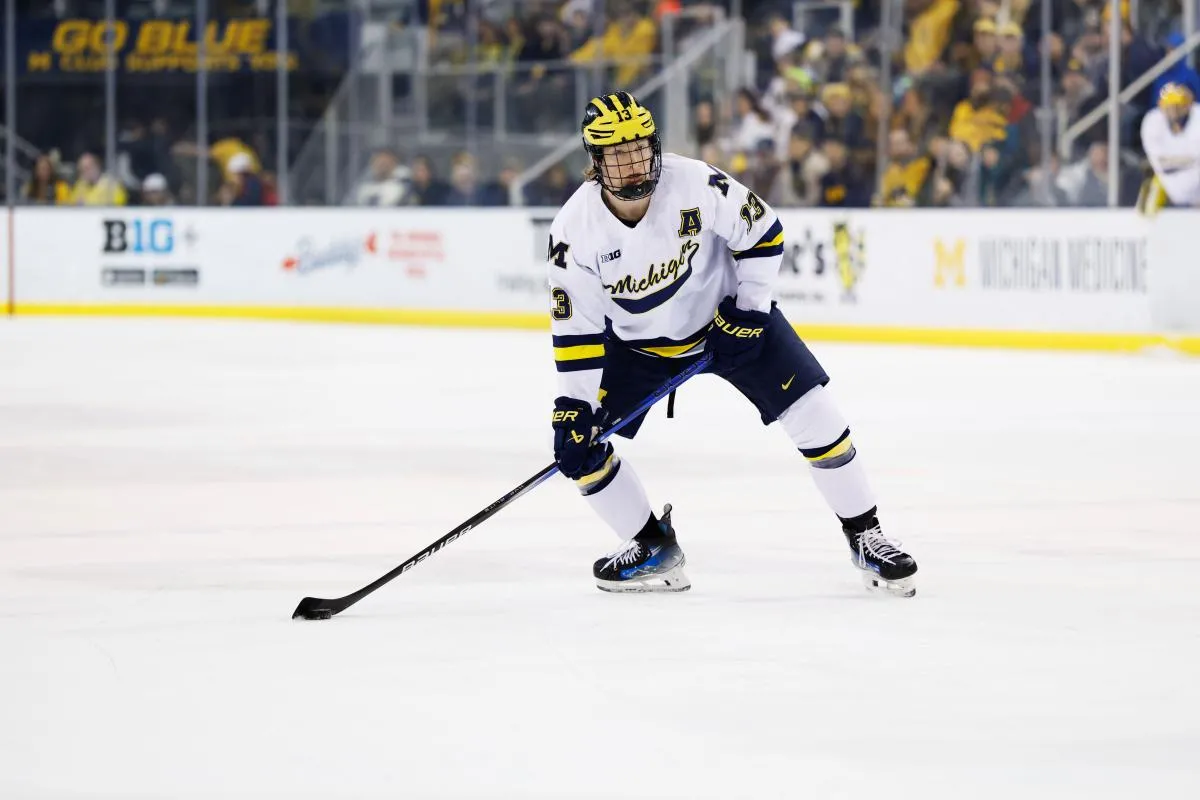 Michigan Wolverines forward T.J. Hughes (13) skates against Penn State during a Big Ten Tournament quarter final game at Yost Arena.