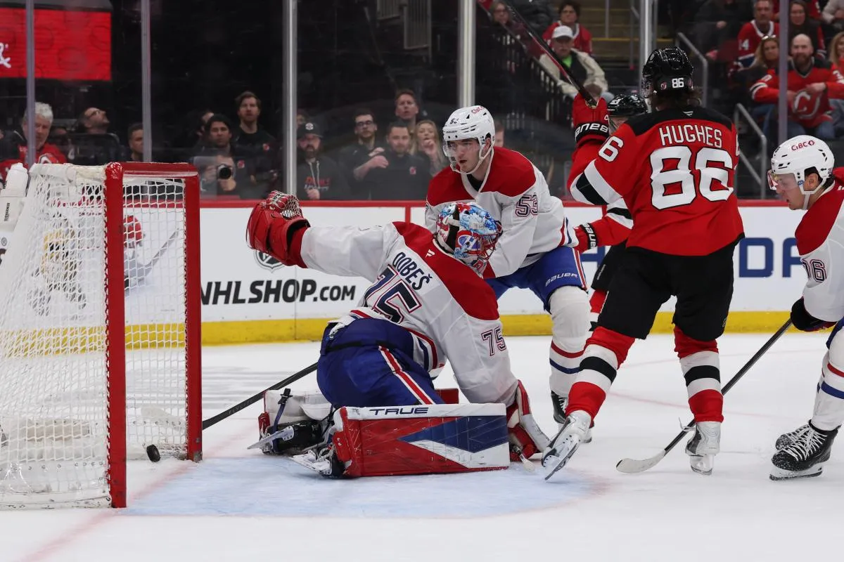 New Jersey Devils center Jack Hughes (86) scores a goal against Montréal Canadiens goaltender Jakub Dobes (75) during the second period at Prudential Center.