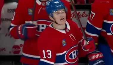 Photo of Cole Caufield yelling on the Canadiens bench.