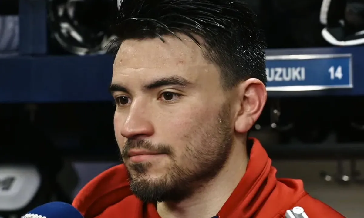 Photo of Nick Suzuki speaking to media post Canadiens-Devils game.