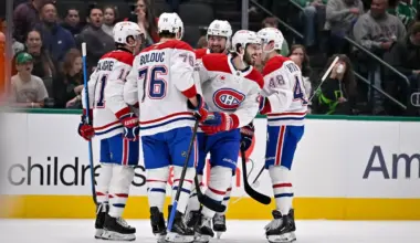Montreal Canadiens right wing Brendan Gallagher (11) and center Phillip Danault (24) and center Zack Bolduc (76) and defenseman Lane Hutson (48) celebrates a goal scored by Gallagher against the Dallas Stars during the first period at the American Airlines Center.