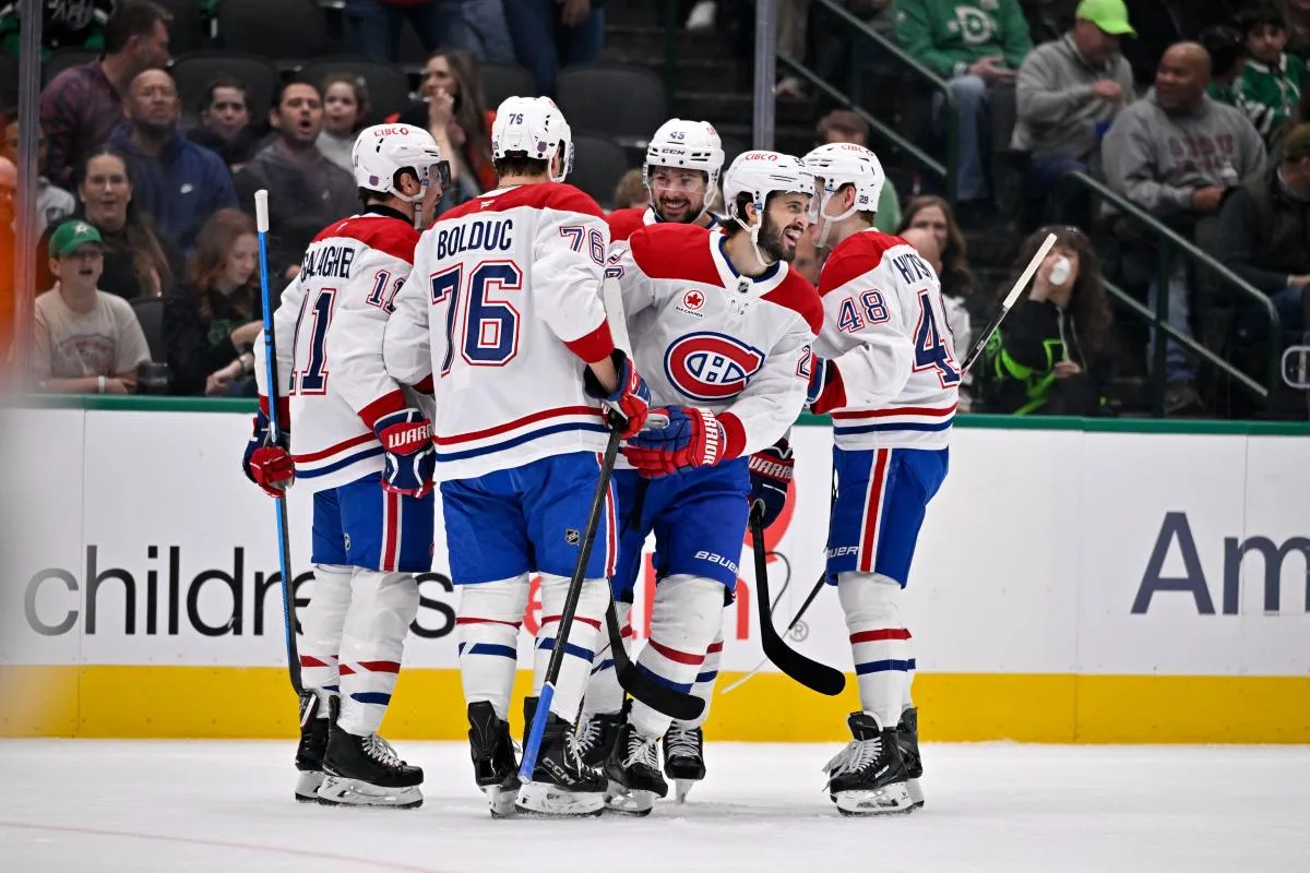 Montreal Canadiens right wing Brendan Gallagher (11) and center Phillip Danault (24) and center Zack Bolduc (76) and defenseman Lane Hutson (48) celebrates a goal scored by Gallagher against the Dallas Stars during the first period at the American Airlines Center.