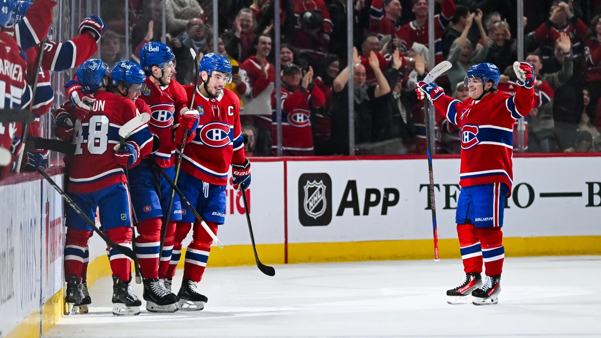 Montreal Canadiens defenseman Kaiden Guhle (21) celebrates with his teammates his second goal of the game against the Carolina Hurricanes in the second period at Bell Centre.