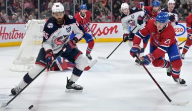 Columbus Blue Jackets forward Kirill Marchenko (86) plays the puck and Montreal Canadiens defenseman Kaiden Guhle (21) defends during the third period at the Bell Centre.