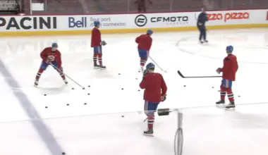 Photo of Kaiden Guhle at Canadiens practice with teammates ahead of Blue Jackets match.