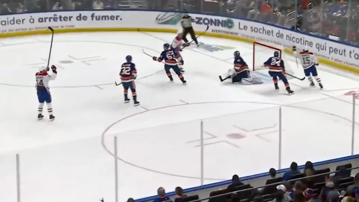 Photo of Alex Newhook scoring third goal of the game against the New York Islanders.