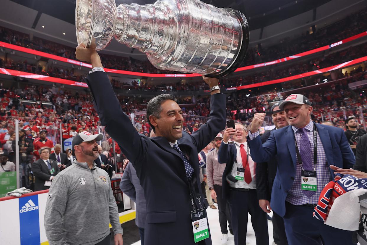 Florida Panthers owner Sunny Mehta raises the Stanley Cup trophy over his head after Game 7.