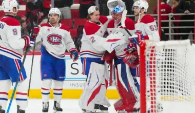 Montreal Canadiens goaltender Jakub Dobes (75) is congratulated by goaltender Jacob Fowler (32), defenseman Noah Dobson (53) and center Alex Newhook (15) after their victory against the Carolina Hurricanes at Lenovo Center.